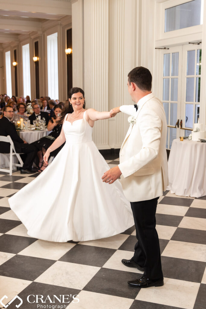 First dance magic! Newlyweds embrace for their first dance as a married couple at the Chicago History Museum reception.