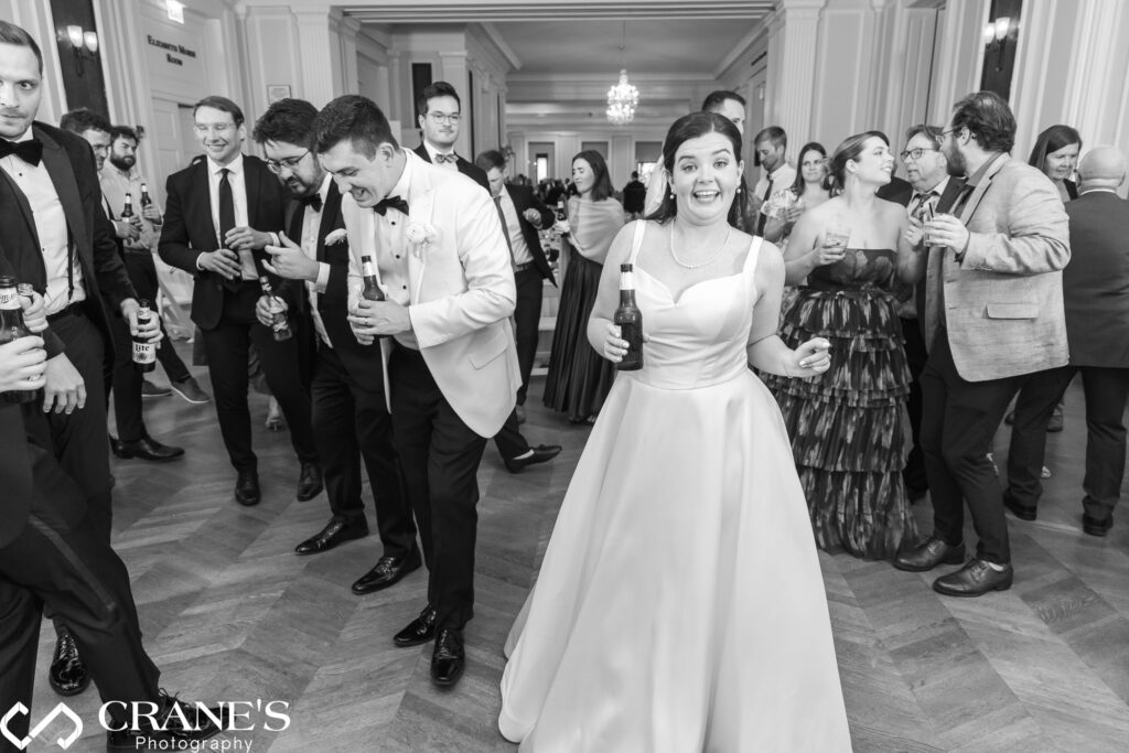 Energetic wedding party rocks the dance floor at the Chicago History Museum reception.