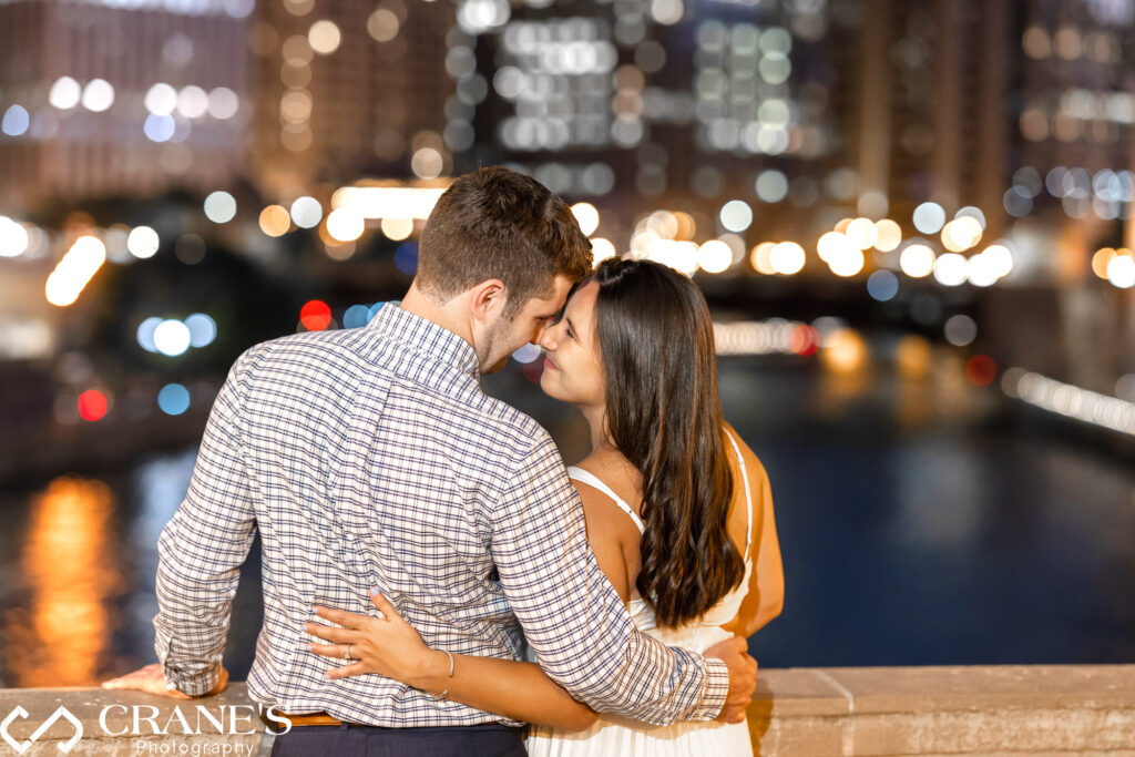 Nighttime Chicago engagement photos at Wrigley Building.