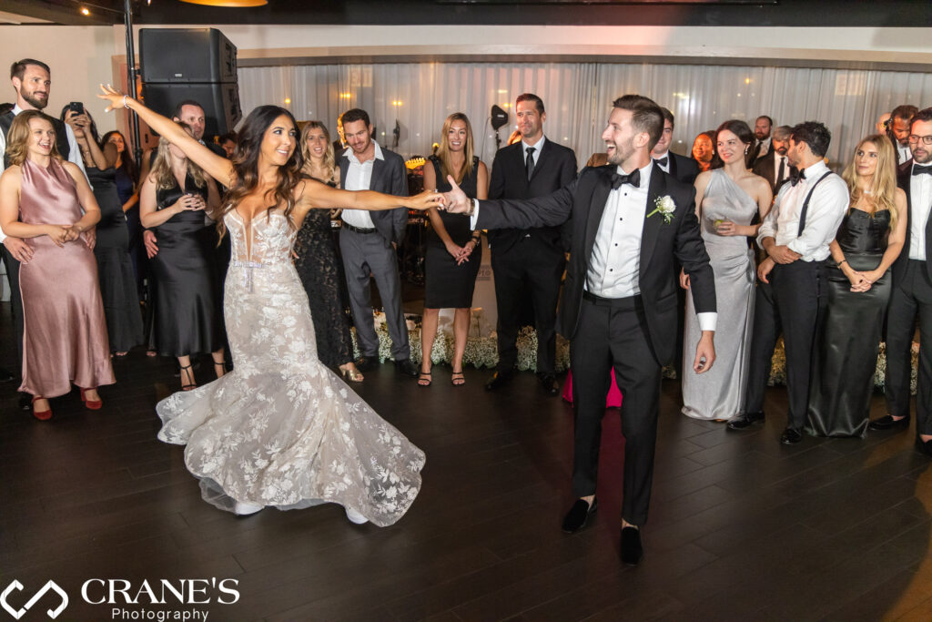 The bride and groom share their first dance as a married couple at their black tie wedding reception at RPM Events.