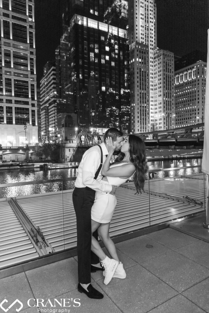 Bride and groom kiss at the end of their black-tie wedding reception at RPM events in Chicago.