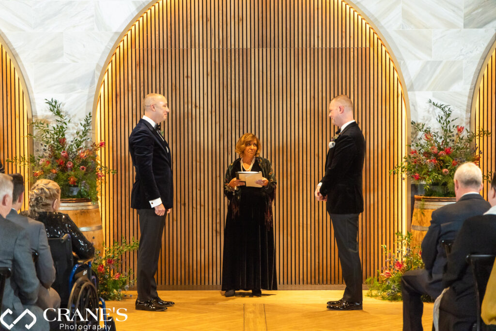 Photo of a gay couple during their wedding ceremony at Chicago Winery.