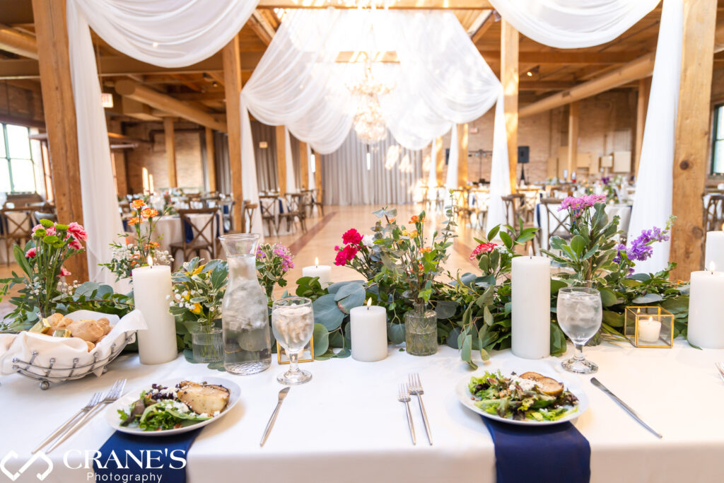 The head table at a wedding at The Skyline Loft at Bridgeport Art Center in Chicago.